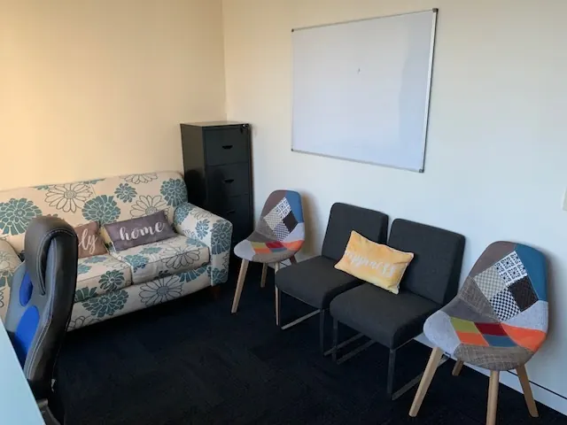 Sofa and armchairs in a Logic Lounge Parramatta consultation room